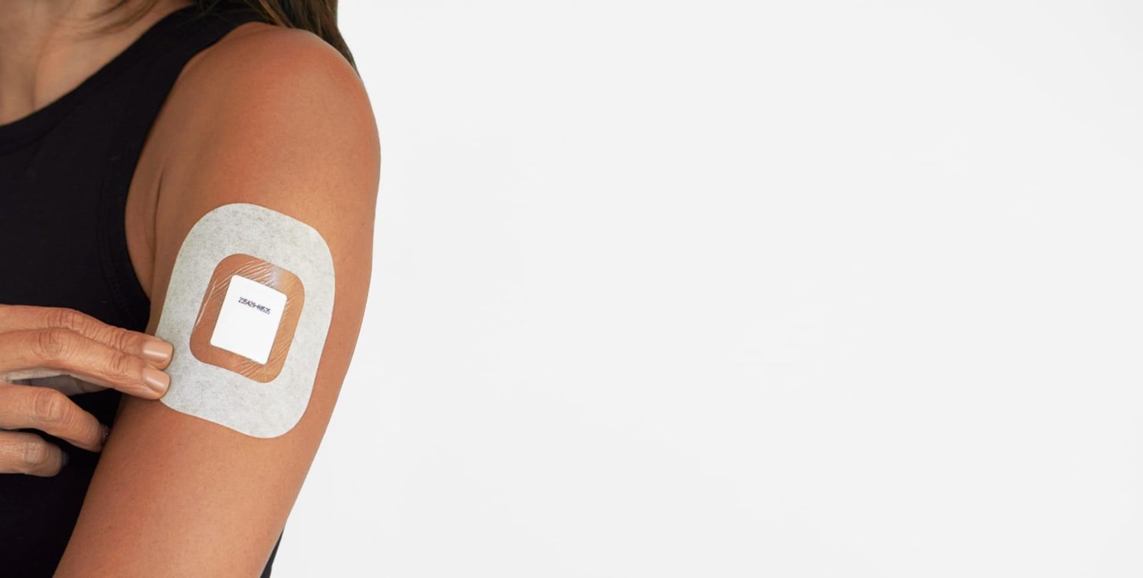 INBS SmarTest sweat patch worn on a subject's upper arm
